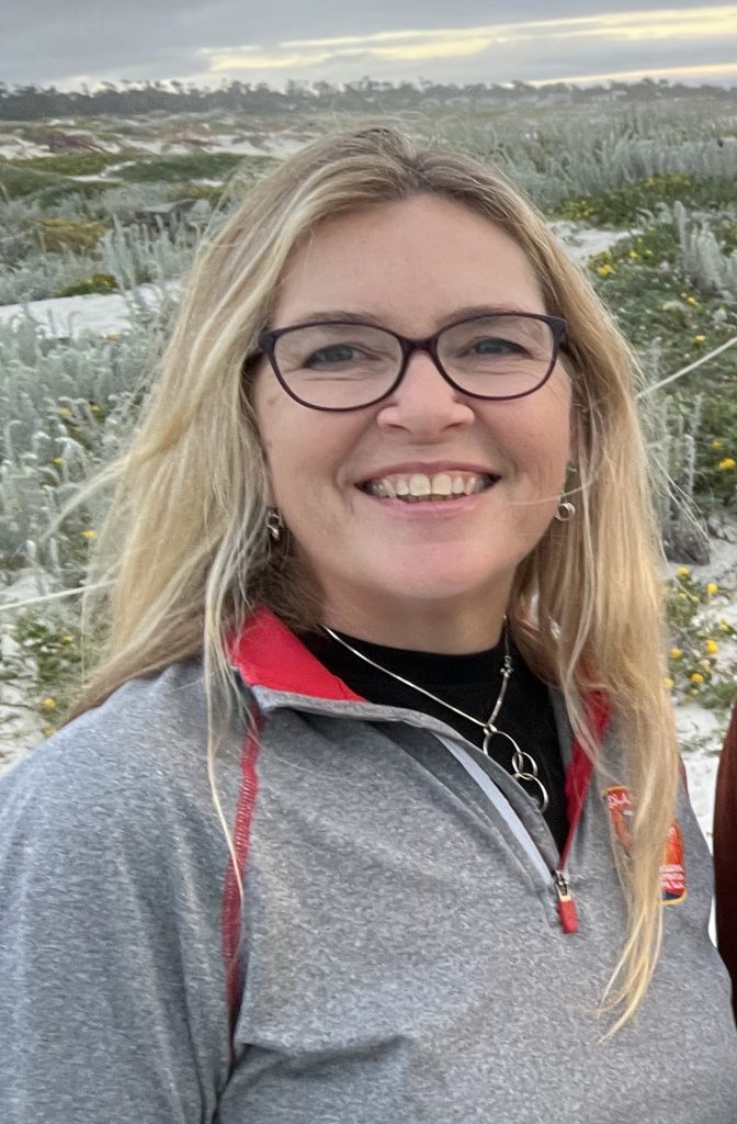 headshot of woman outdoors